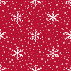 Red Christmas pattern seamless with white snowfall. 