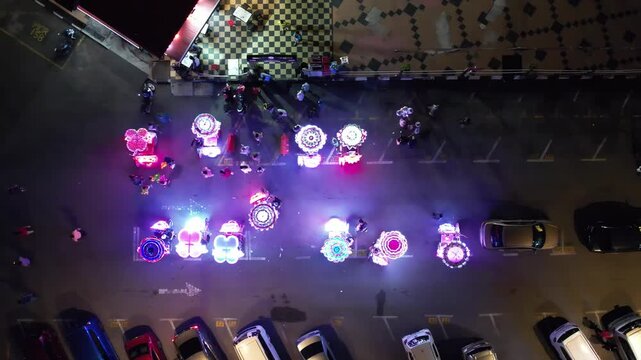 Melaka, Malaysia&mdash;July 6, 2023 Top view of illuminated rickshaws, moving to the left.