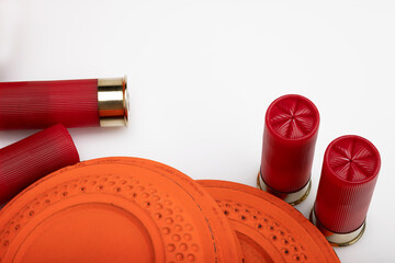 Clay shooting target with shotgun shells on white isolated background , Shotgun game © Suttiwan