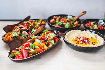 Healthy vegetarian food with hummus and salads