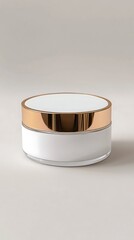 A luxurious and elegant white cosmetic powder compact with a gleaming gold lid presented on a neutral background for beauty and skincare product photography