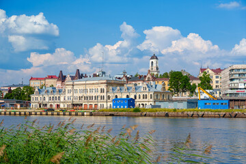 Historic waterfront buildings in Vyborg on a sunny summer day
