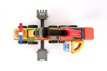 Overhead View of Vibrant Magnetic Toy Crane Truck Assembled with Colorful Blocks