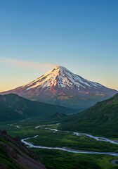 Fototapeta premium Majestic Snow-Capped Volcano Overlooking Lush Green Valley and Winding River at Sunrise.