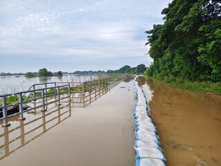 A large river overflowing its banks indicates a flood situation.