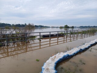 A large river overflowing its banks indicates a flood situation.
