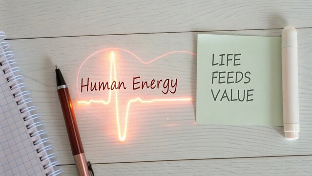 Vibrant Representation of Human Energy Concept with Heartbeat Icon on Table Surrounded by Stationery and Sticky Note