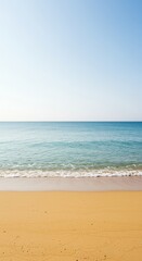 Fototapeta premium A vast, quiet stretch of golden sand meeting the calm ocean waves under a bright summer sky, symbolizing peace and untouched nature's solitude ,peaceful ,summer ,serene
