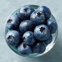 Fresh Blueberries in Clear Bowl with Water Droplets on Surface