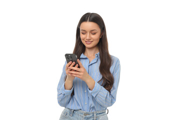 Woman enjoys using her smartphone while standing and smiling, PNG