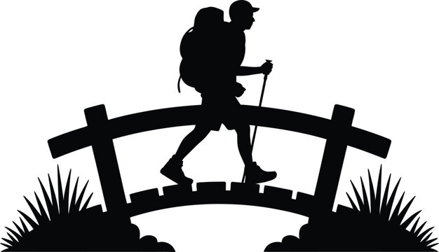 Hiker with trekking poles crossing a bridge silhouette
