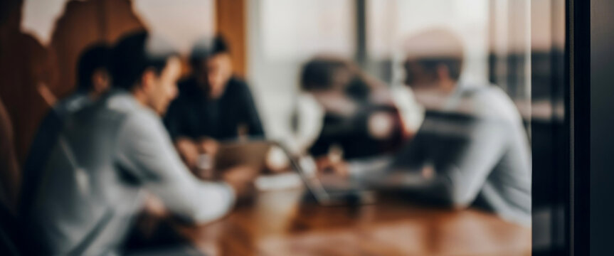 Blurred view of people meeting around a table through glass, representing collaboration, planning, and open communication in a bright modern office that reflects teamwork and business focus. - Powered by Adobe