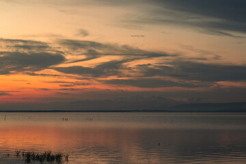 Scenic Lake at Sunset with Cloudy Sky