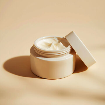 Minimalist beige skincare cream jar with open lid on warm background 3