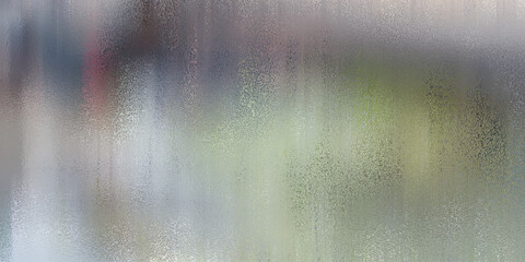 Abstract blur of light and color with vertical streaks creating a textured background effect