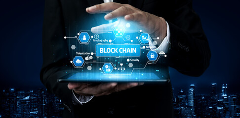 A professional presenting a vibrant digital blockchain interface on a tablet, featuring various technology icons. A modern city skyline serves as a dramatic background. Tessel