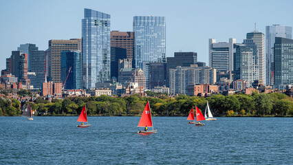 People are surfing in Charles river under a sunny day	