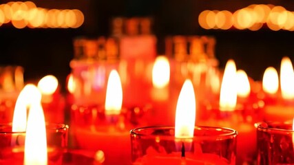 Warm glowing candles flicker in a captivating display, casting a serene and inviting ambiance perfect for mindful reflection and cozy nights in, offering a sense of peace and tranquility - Powered by Adobe