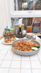 Kwetiau goreng  is a Chinese Indonesian stir fried flat rice noodle dish made from kwetiau, which are stir fried in cooking oil with garlic, onion ,beef, chicken, fried prawn, crab and other vegetable