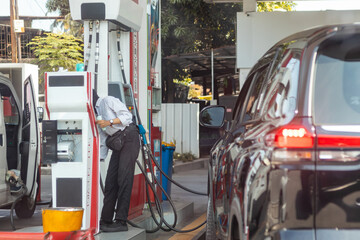 Queuing cars waiting to buy fuel at a gas station in Jakarta, Indonesia