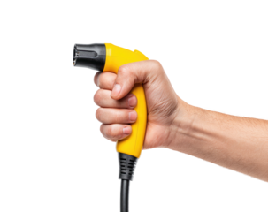 Hand holds yellow electric vehicle charging connector, ready to plug in