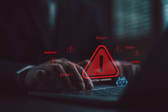 Close-up of hands typing on a laptop with red system error warnings and AI bot detection interface, symbolizing cybersecurity threat, system failure, or smart error monitoring.