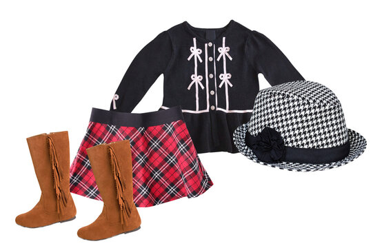 girls' stylish autumn school ensemble: black cardigan with bow accents, red tartan plaid skirt, brown suede fringed boots, and a classic houndstooth fedora hat, isolated.