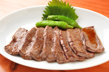 Sliced Grilled Beef Tongue with Shishito Peppers