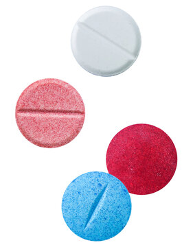 close-up studio shot of four brightly colored round pills or tablets, isolated on a solid transparent background, representing drug use or medication.