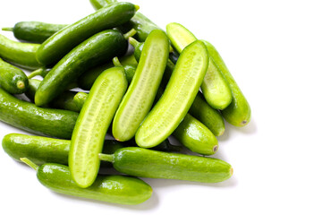 Fresh mini baby cucumbers on white background
