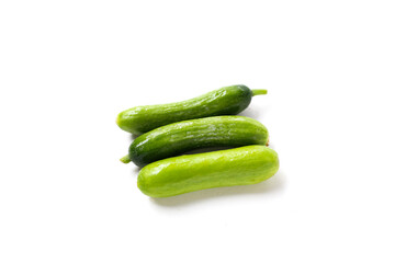 Fresh mini baby cucumbers on white background