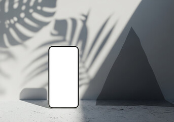 White Screen Smartphone Display on Textured Surface with Sunlight and Tropical Leaf Shadow Casting Against Wall