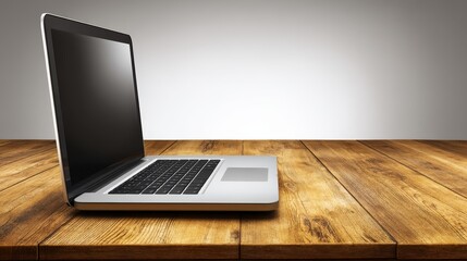 High tech laptop computer displayed on elegant wooden tabletop in minimalist workspace.