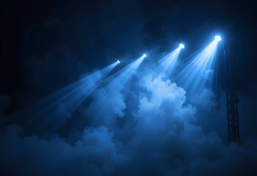 Blue stage spotlights, thick fog with dramatic concert lighting. atmospheric performance scene. ideal for music events, nightlife ads or immersive digital backgrounds.