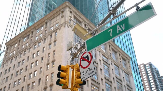 7th Avenue traffic lights in New York. Close-up of the green traffic lights and 7th Avenue sign in Manhattan.