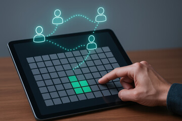 Digital tablet with hand pointing at grid interface and connected user icons representing emergency communication technology