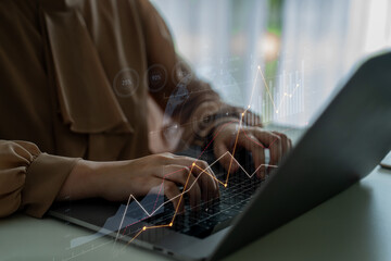 A professional woman engaged in work on her laptop, with a digital overlay of financial graphs and data, symbolizing modern business analysis and investment strategies. Scalp