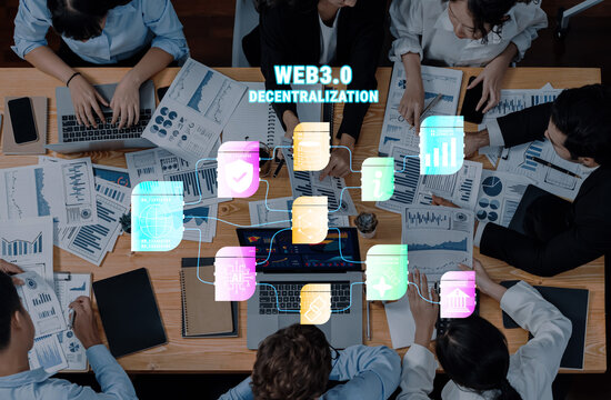 A collaborative workspace featuring a diverse team analyzing data and strategies related to Web3.0 and decentralization. Ideal for business and technology themes. Trope - Powered by Adobe