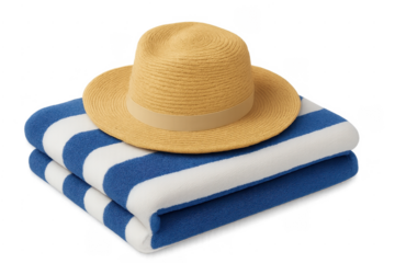 Straw hat resting on blue striped beach towel, summer vacation essentials