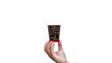 Isolated hand holding paper coffee cup with black lid. Enjoying takeaway coffee with stylish cup