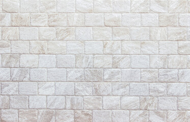 Detail of modern cream brick wall background photo. White light brick wall texture background for stone tile block painted in beige light color wallpaper modern interior and exterior backdrop design.