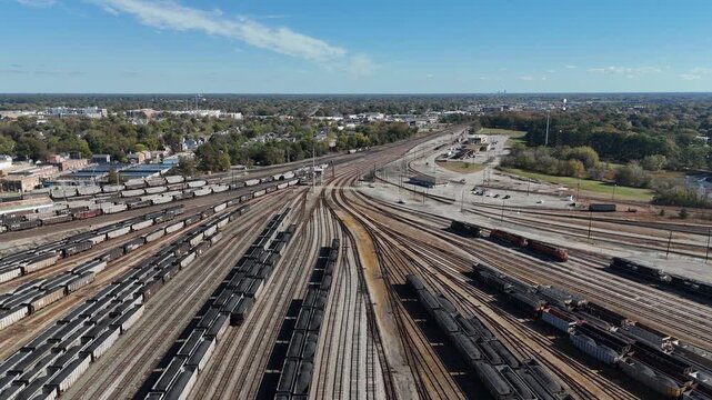 Lambert's Point Railyard and coal transloading facility filled with rail cars along the Elizabeth River in Norfolk Virginia 4k aerial drone video