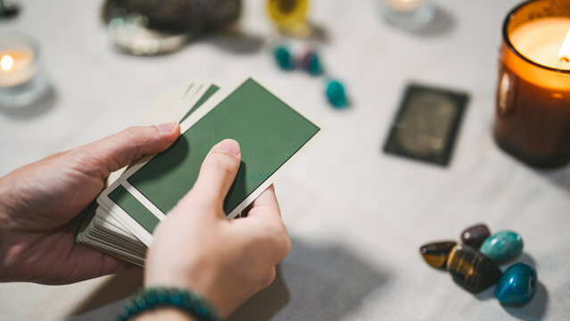 Fortune teller reading tarot cards using divine magic occultism