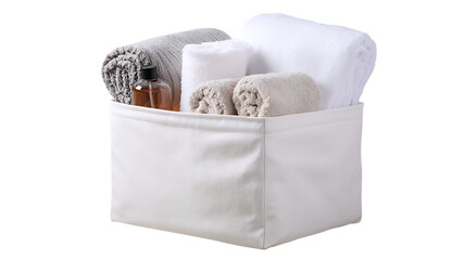 White storage basket filled with towels and toiletries isolated on transparent background