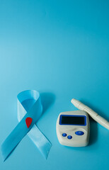 Healthcare and medical concept, Stethoscope and blood glucose meter sets on blue background, World Diabetes day, 14 November.