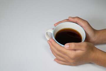 Holding a Coffee Cup with Both Hands