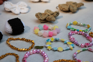 Vibrant Collection of Handmade Beaded Bracelets and Crochet Charms.