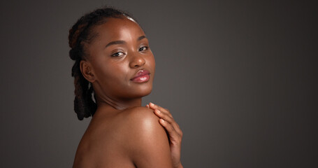 Shoulder, skincare and portrait of black woman in studio for hydration, self care and dermatology....