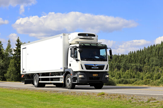 White MAN TGM Temperature Controlled Transporter at Speed on Road. 