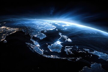 Southeast Asia from space, illuminated by night. Vast network of lines connects cities, highlighting global connections. Sunrise flare